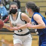Keith Thorpe/Peninsula Daily News
Port Angeles' Bailee Larson, left, prepares to pass around the defense of East Jefferson's Aurin Asbell on Tuesday night at Port Angeles High School.