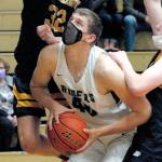 Keith Thorpe/Peninsula Daily News
Port Angeles' John Vaara, center, is surrounded by Bainbridge defenders Luike Lavigne, left, and James Carey during the third quarter on Thursday in Port Angeles.