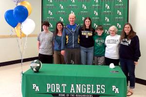 Port Angeles senior Ava Brenkman, fourth from left, signed a letter of intent as an invited walk-on to play college volleyball for Whitman College in Walla Walla. Brenkman was joined by family members, including her dad Sam Brenkman, third from left, and mom Katie Marks, far right.