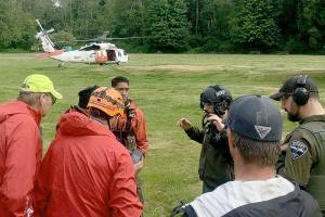 Search and Rescue team members used the Dosewallips State Parks field as their command post for the multi-agency rescue of two hikers who had fallen down the Brothers Mountain on Sunday afternoon. Teams from Jefferson Search and Rescue, Jefferson County Sheriffs Office, Naval Air Station Whidbey Island Search and Rescue and Olympic Mountain Rescue responded to the emergency. (Jefferson Search and Rescue)