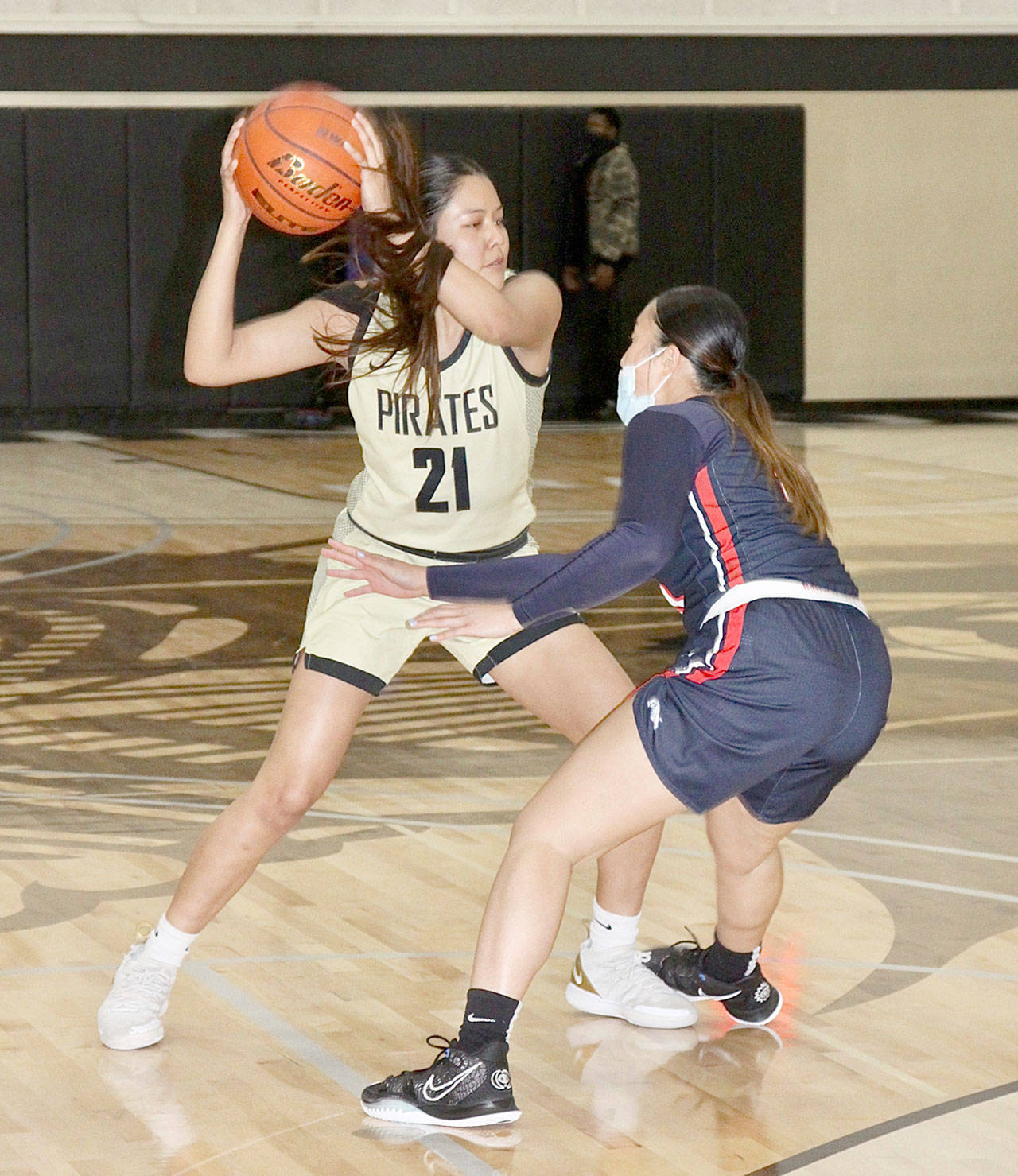 Tasiah Little of the Peninsula College womens basketball team is guarded by Bellevues Keani Midel on Monday in Port Angeles. (Dave Logan/for Peninsula Daily News)