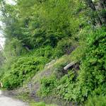 Bicyclists ride through a recent slide area at milepost 3.5 on the Waterfront Trail on Wednesday near Four Seasons Ranch east of Port Angeles. (Keith Thorpe/Peninsula Daily News)