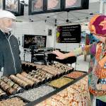 Keith Thorpe/Peninsula Daily News 

Saffrel Cochon of Monroe, right, tries on a bracelet as vendor Larry Rankin of Leavenworth-based Art to Suit You looks on at the Juan de Fuca Festival street fair outside the Vern Burton Community Center in Port Angeles. Admission to the fair, which runs through 6 p.m. today, is free. In-person concerts inside the community center continue today with limited tickets. More than 20 performances from multi-genre bands, singer-songwriters, dance ensembles and solo artists across North America are available for streaming on demand until June 30. More details are at JFFA.org/festival.