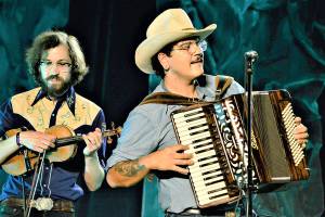 During the Juan de Fuca Festival in Port Angeles, the band Gus Clark and the Least of His Problems -- with Jonah Byrne, left, and Clark -- provided a Saturday night set of country music inside the Vern Burton Community Center. The festival included a street fair and live concerts plus 20 virtual performances, which are still available via the Juan de Fuca Foundation for the Arts website, JFFA.org/festival. Diane Urbani de la Paz/Peninsula Daily News