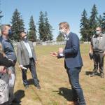 U.S. Rep. Derek Kilmer, center, speaks to, from left, Port Angeles School Board President Sarah Methner, Port Angeles City Councilman Mike French, School Superintendent Martin Brewer and school district Maintenance and Facilities Director Nolan Duce during a visit to Monroe Fields. (Keith Thorpe/Peninsula Daily News)
