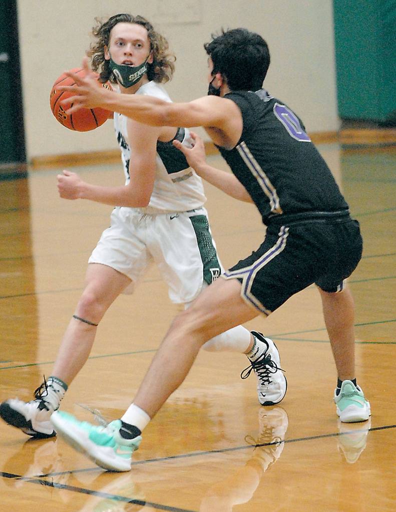 Keith Thorpe/Peninsula Daily News Port Angeles Dru Clark, left, advances the ball as North Kitsaps Johny Olmsted defends on Thursday in Port Angeles.