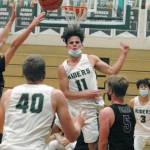 Keith Thorpe/Peninsula Daily News Port Angeles Xander Maestas, center, passes to teammate John Vaara as North Kitsaps Colton Bower, right, looks on during Thursdays game in Port Angeles.