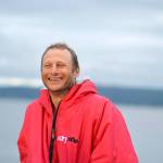 Following a hot shower, Carter Johnson went out on the Northwest Maritime Center dock to await the rest of the racers. (Diane Urbani de la Paz/Peninsula Daily News)