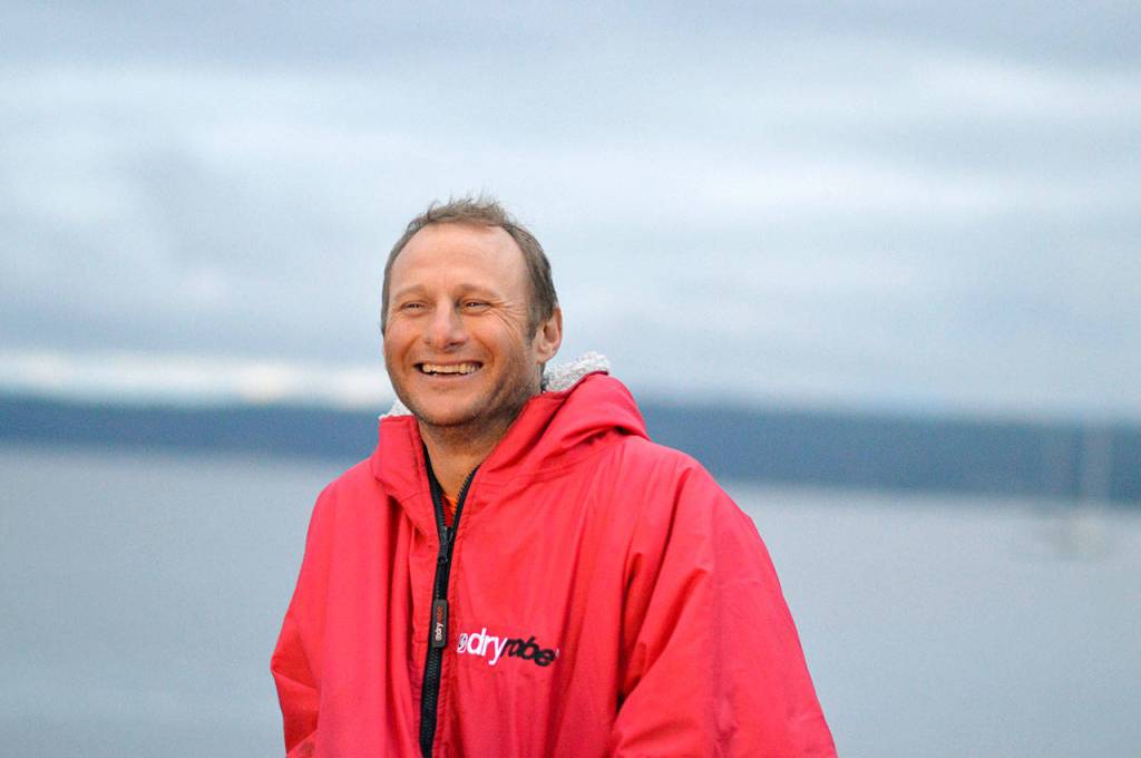 Following a hot shower, Carter Johnson went out on the Northwest Maritime Center dock to await the rest of the racers. (Diane Urbani de la Paz/Peninsula Daily News)