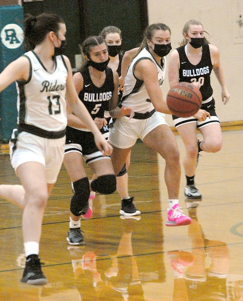 Keith Thorpe/Peninsula Daily News Port Angeles Jaida Wood, center, drives down court with the ball surrounded by North Masons Rachel Youngman and Tessa Griffey as Woods teammate, Bailee Larson, left, keeps pace.