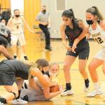 Lonnie Archibald/for Peninsula Daily News
Hustling for the ball Monday in Forks are Napavine's Rae Sisson (left) and Forks' Kadie Wood. Looking on from the right are Napavine's Natalya Marcial and Forks'  Kray Horton (12). Napavine got by the Spartans 54-52 to end Forks' season.