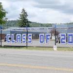 Chimacum School District has lined the fence outside of the school along Rhody Drive with banners honoring its 2021 graduating class. Public high schools across the North Olympic Peninsula are conducting their graduation ceremonies this weekend. (Zach Jablonski/Peninsula Daily News)