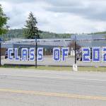 Chimacum School District has lined the fence outside of the school along Rhody Drive with banners honoring its 2021 graduating class. Public high schools across the North Olympic Peninsula are conducting their graduation ceremonies this weekend. (Zach Jablonski/Peninsula Daily News)