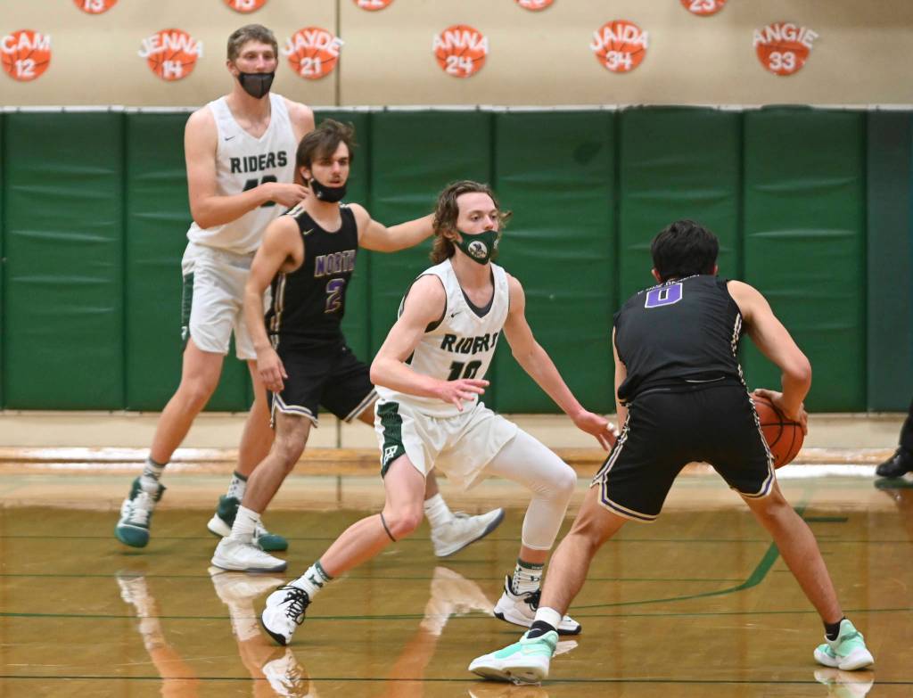 Michael Dashiell/Olympic Peninsula News Group Port Angeles Dru Clark defends against North Kitsaps Johny Olmstead during the Olympic League Championship game Wednesday.