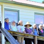 Celebrating the reopening of the Quimper Grange this Saturday are, from left, George and Jo Yount, Susan Stone, Barbara Tusting, Kathy Ryan, Sheila Long, Mary Beth Haralovich, Doug Groenig and J.J. Johnson. (Diane Urbani de la Paz/Peninsula Daily News)