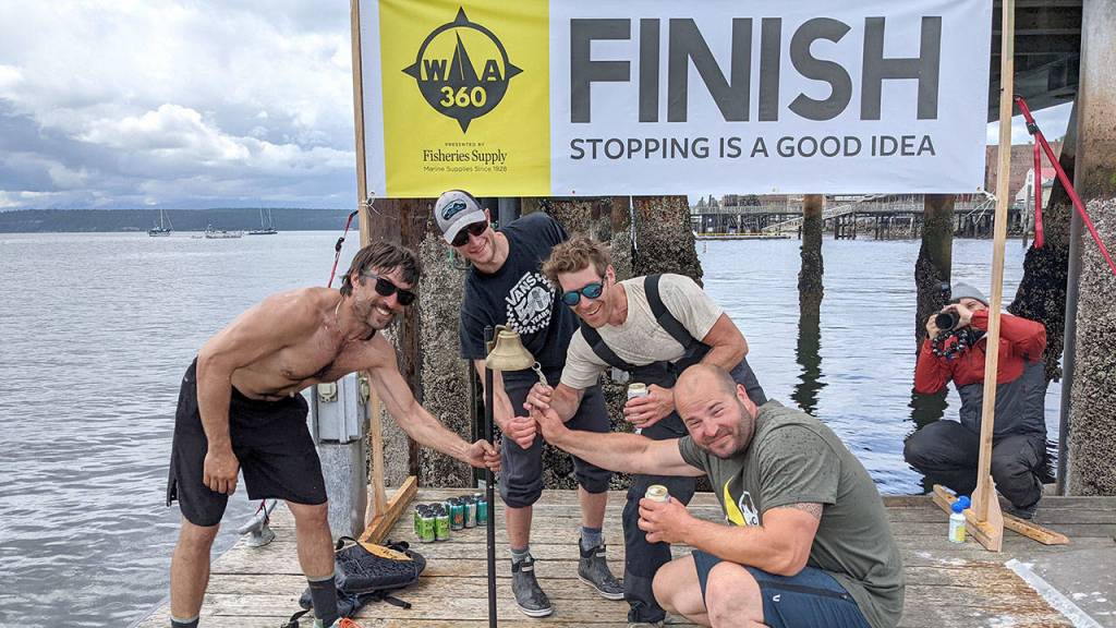 Team Fressure Andrew Bly, left, Casey Pruitt, Charlie Boremann and Justin Hinchcliffe finished in close second in the WA360 race, reaching the finish line Port Townsend at 1:06 p.m., seven minutes after the first place finishers. (Zach Jablonski/Peninsula Daily News)