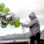 Port Angeles High School senior Brielle Keywood holds balloons while preparing for Fridays Senior Parade to celebrate the Class of 2021. (Keith Thorpe/Peninsula Daily News)