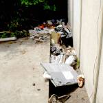 Piles of refuse sit next to an empty building in the 200 block of East Front Street in Port Angeles on Thursday. (Keith Thorpe/Peninsula Daily News)