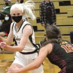 Keith Thorpe/Peninsula Daily News
Port Angeles' Millie Long, left. drives around Kingston's Brianna Jorgensen in Port Angeles in May. Long was named the Olympic League 2A girls MVP.