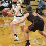 Port Angeles Millie Long, left. drives around Kingstons Brianna Jorgensen in Port Angeles in May. Long was named the Olympic League 2A girls MVP. (Keith Thorpe/Peninsula Daily News)
