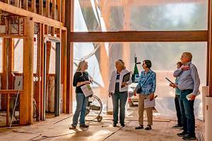 Lyn Muench, grant writer for the Dungeness River Audubon Center’s “Inspire Wonder” capital campaign, shows Rep. Steve Tharinger details of River Center construction. Photo by Margi Palmer