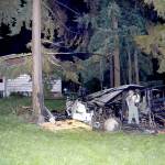 Officials with Jefferson County Sheriffs Office, Washington State Patrol and the FBI investigate the site of an explosion in Port Hadlock on Tuesday night. The explosion reportedly blew off a mans arm and burned his 6-year-old granddaughter. The blast and subsequent fire destroyed an outbuilding and damaged the trees and grass around it. (Photo courtesy of Jefferson County Sheriffs Office)