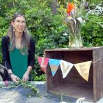 Christine Loewe, executive director of the Port Angeles Fine Arts Center, prepares a table display for Saturdays Summertide Solstice Art Festival. (Keith Thorpe/Peninsula Daily News)