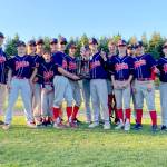 Swains captured the Olympic Junior Babe Ruth baseball championship with a 12-7 win over Athletes Choice. Team members and coaches are from left, coach Eric Flodstrom, Jude Wallace, Jordan Shumway, Hunter Tennell, Khyler Thompson, Joseph Ritchie, Aiden Swenson, Bryton Amsdill, Trae Hanson (behind trophy), Tanner Jacobsen, Luke Flodstrom, Tate Alton, coach Tim Adams, Ryland Proettie and Cody Martin.