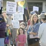 Mariia Bush stands with her two daughters, Madison, 9, and Avery, 6, during the Juneteenth Protest Against Racism and Hate on Saturday in downtown Sequim. (Matthew Nash/Olympic Peninsula News Group)