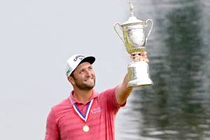 Jon Rahm of Spain holds the champions trophy for photographers after the final round of the U.S. Open Golf Championship, Sunday, June 20, 2021, at Torrey Pines Golf Course in San Diego. (Jae C. Hong/The Associated Press)