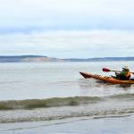 Roy Walker of Port Townsend stays close to shore as he launches his kayak from North Beach County Park on Wednesday morning. Hugging the shore and staying mindful of wind and weather changes are crucial, emergency responders say. Diane Urbani de la Paz/Peninsula Daily News