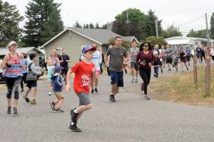 Lonnie Archibald/for Peninsula Daily News
They were off running and walking in Forks during Saturday's Fourth of July Fun Run presented by the Forks Community Hospital. The celebration peaks today with a Grand Parade and a host of other events.