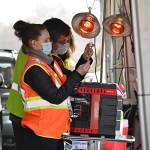 Registered nurses Kelly Bower and Dmitriy Lisenkoff prepare COVID-19 vaccination doses at the Jamestown Family Health Clinic drive-thru clinic in Sequim in March. Michael Dashiell/Olympic Peninsula News Group