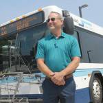 Clallam Transit General Manager Kevin Gallacci stands in front of a Route 20 bus. The route will see expanded service, including Peninsula College and Olympic Medical Center. (Keith Thorpe/Peninsula Daily News)