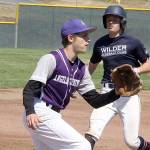 Wilder Jr baserunner Elijiah Flodstrom cruises into third base safely as the Kitsap 3rd baseman waits for the ball. 
Note: The Kitsap team you will note is wearing uniforms that say Angeles Furniture on it. The story is that all the ball players are from the Kitsap area except Jaxson Gray from Sequim. The Grays own Angeles Furniture in PA and were able to supply the whole team with uniforms with their name on it as there was a uniform problem for the Kitsap team.  dlogan
