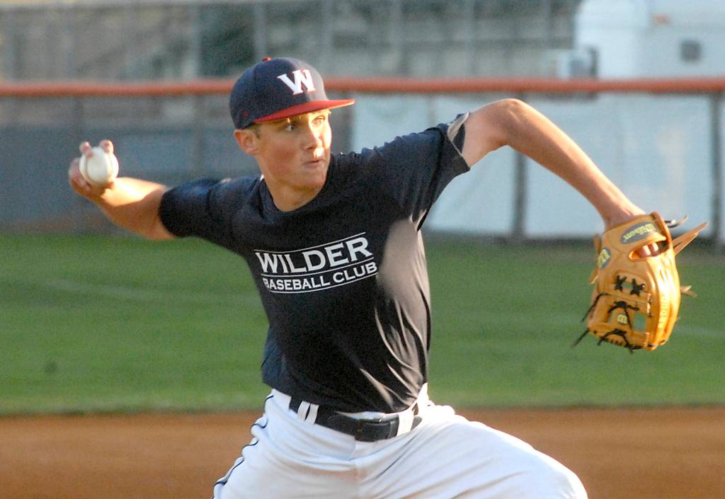 Keith Thorpe/Peninsula Daily News Wilder pitcher Kole Acker hurls in the first inning against WBS Colts Red on Saturday night at Port Angeles Civic Field.