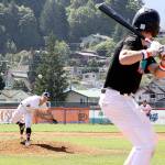 Logan Olson of Wilder Sr. fires a pitch to the plate against the WBS Colts Black team in Sundays semifinal. Wilder won 18-6 to move on to the championship game later that night, which Wilder also won 10-0 over the Riverdogs. (Dave Logan/for Peninsula Daily News)