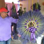 <strong>Matthew Nash</strong>/Olympic Peninsula News Group
Sergio Gonzalez stands with one of the wreaths he made for a customer from lavender in his field at Melis Lavender Farm. He hopes visitors will find his farm off Old Olympic Highway this summer as COVID-19 greatly impacted his sales in 2020.