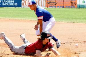 Dave Logan/for Peninsula Daily News
Jeremy Vierra of the Redmond Dudes is safe on a throw to first base Sunday. Playing first base for the Lefties is Nathan Chong of Saint Mary's College of California.