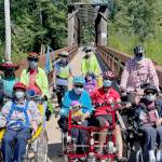 Members of the Sequim Wheelers break out all four of the nonprofits adaptive bikes for the first time on June 21, the first day of summer. (Photo by Tom Coonelly)