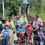 Members of the Sequim Wheelers break out all four of the nonprofits adaptive bikes for the first time on June 21, the first day of summer. (Photo by Tom Coonelly)