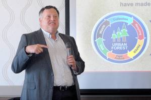 Peter Johnson, human resources manager for the McKinley Paper Co. mill in Port Angeles, talks about his company during Wednesdays Port Angeles Chamber of Commerce luncheon. (Keith Thorpe/Peninsula Daily News)