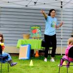 Rosaletta Curry, the Jefferson County Librarys early childhood program coordinator, begins story time by pointing out elements of the environment, such as trees. Ellie Long, 4, left, is among the listeners at story time outside the Port Townsend Library last Thursday. Story hours are offered free at libraries across the North Olympic Peninsula. For information, see NOLS.org and PTpubliclibrary.org. (Diane Urbani de la Paz/Peninsula Daily News)