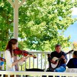 A group of friends from Jefferson and Island counties met Monday to play music as they do year-round at Port Townsends Chetzemoka Park gazebo. In the foreground is Dianne Boeger; playing Shetland Islands tunes with her, from left, are fiddler Mhaire Merryman, bouzouki and guitar player Donald Terao and English concertina player Len Feldman. (Diane Urbani de la Paz/Peninsula Daily News)