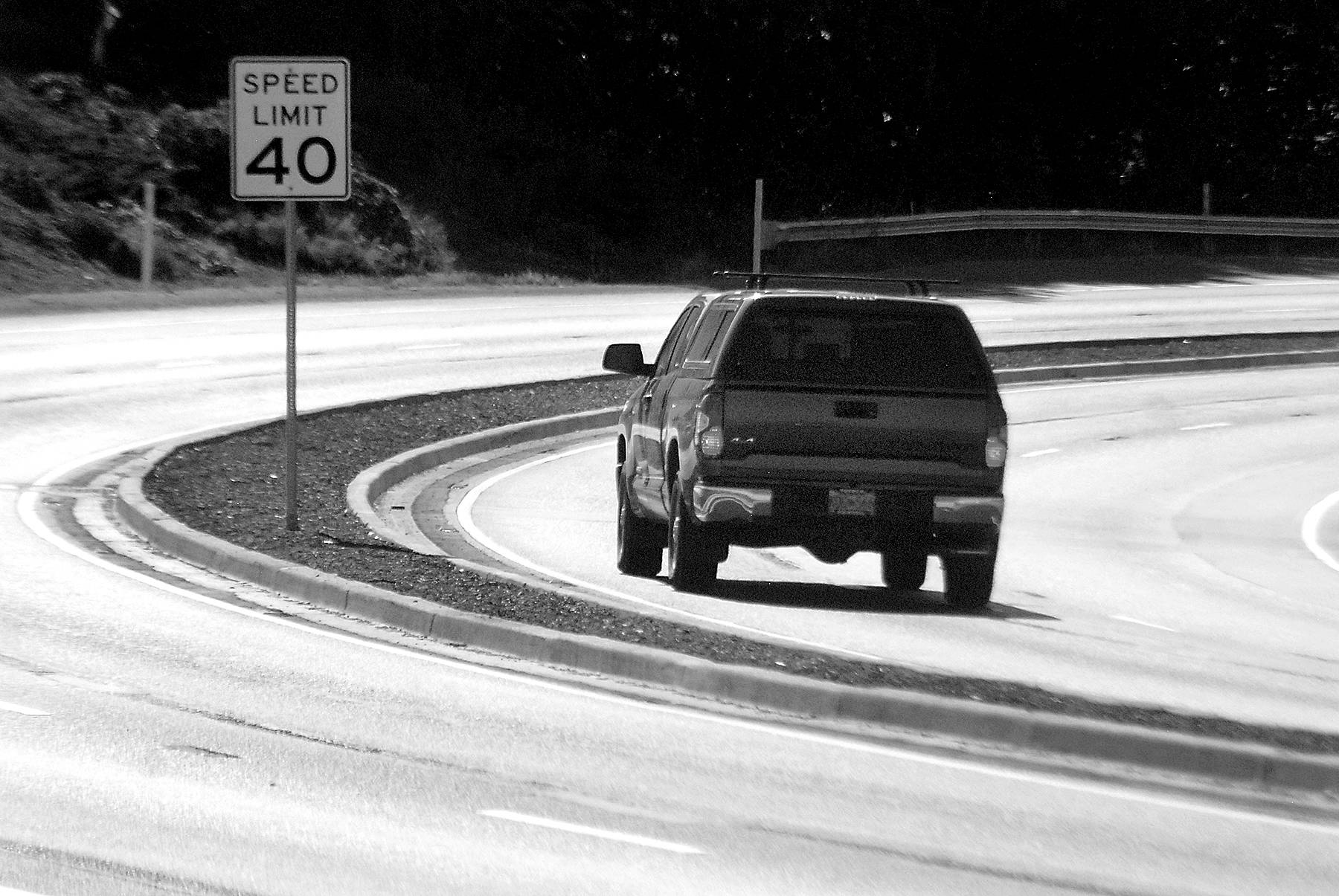 Keith Thorpe/Peninsula Daily News
A truck makes its way around a curve on a newly-divided section of U.S. Highway 101 on Saturday as the road descends into Morse Creek Valley east of Port Angeles.