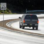 Keith Thorpe/Peninsula Daily News
A truck makes its way around a curve on a newly-divided section of U.S. Highway 101 on Saturday as the road descends into Morse Creek Valley east of Port Angeles.