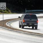 Keith Thorpe/Peninsula Daily News
A truck makes its way around a curve on a newly-divided section of U.S. Highway 101 on Saturday as the road descends into Morse Creek Valley east of Port Angeles.
