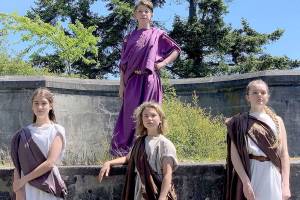 Port Townsend eighth-grader Peter Sanok, top, plays the title role in Timon of Athens, the movie to screen this week at Chimacums Finnriver Farm & Cidery. Costarring are, from left, eighth-graders Auden Darrock and Anna Munn and seventh-grader Sierra Douglas. (Photo by Maggie Kelley)