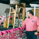 Builder Bliss Morris is preparing the Stop and Smell the Rhodies-themed float for Saturdays Rhody Grand Parade. (Diane Urbani de la Paz/Peninsula Daily News)