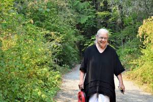 Artist Sara Mall Johani, pictured outside her workshop in Chimacum, will present her new book, "Mine, Yours, Nobody's: My Story of Wild Olympic Salmon," at the Jefferson Museum of Art & History this Saturday. (Diane Urbani de la Paz/Peninsula Daily News)